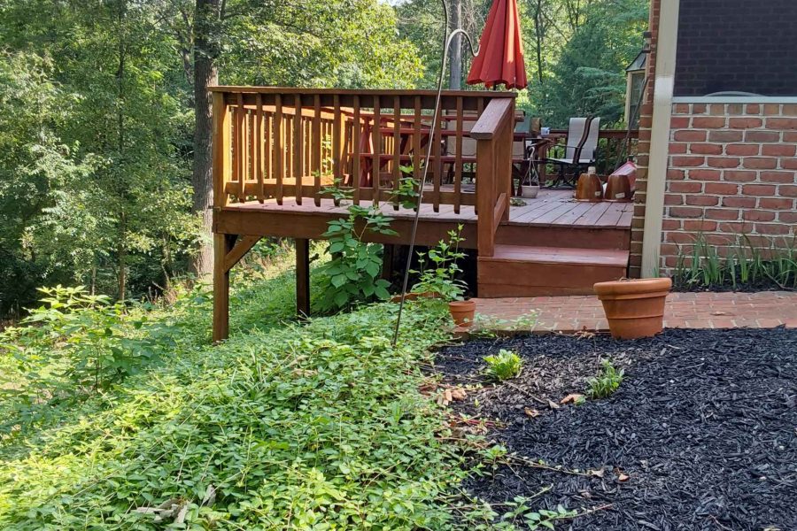 A deck on risers before replacement by deck contractors